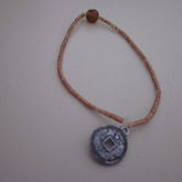 Single With Small Brown Beads And Silver Charm
