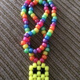 Yellow Pacman Ghost On Metallic Rainbow Necklace