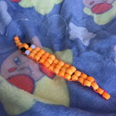 Orange Kandi Worm On A String