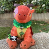 A Dragon Keychain With A Kandi Bracelet 